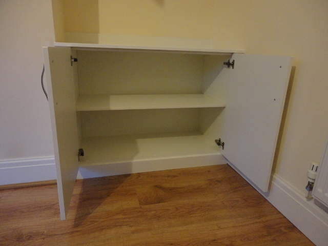 Bespoke cabinet made to fit in dining room alcove