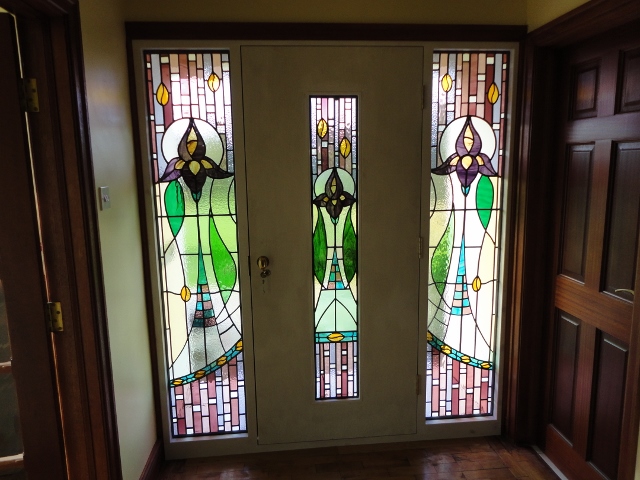 Bespoke front door frame and door made to show off the stained glass
