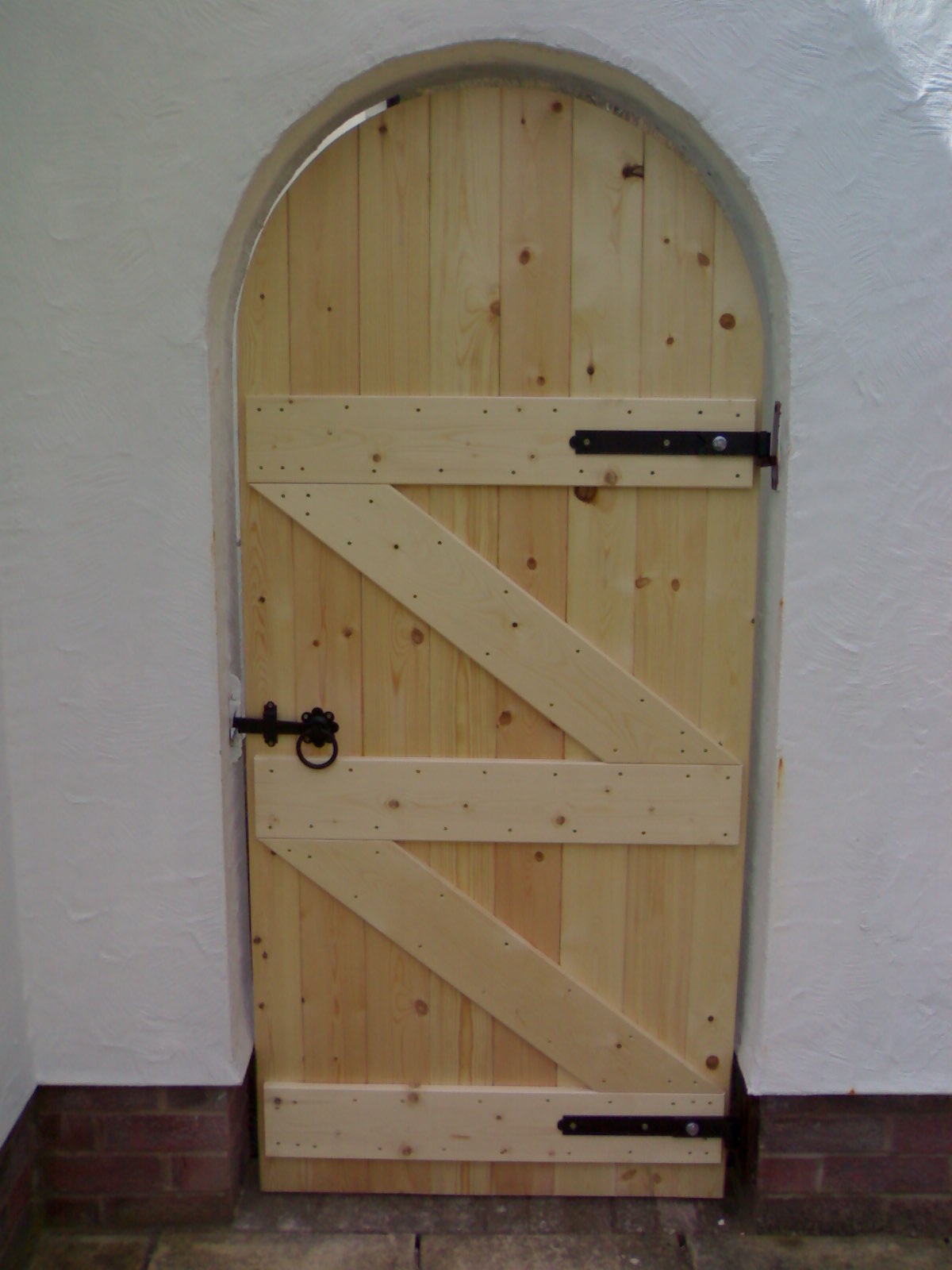 Solid wood arched gate.jpg