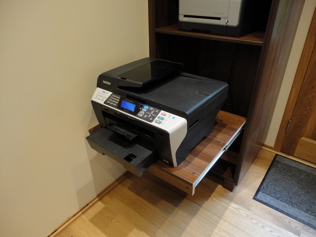 Office furniture housing a printer