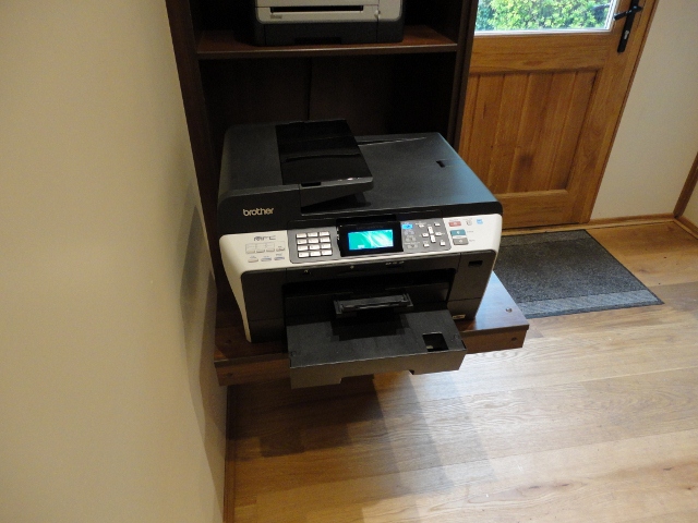 Office furniture housing a printer